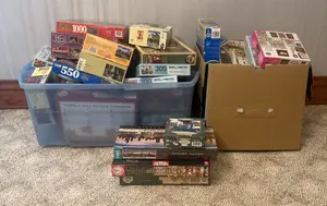 A Large Collection of Assorted Jigsaw Puzzles Featuring Buffalo Games, Educa, Cobble Hill, and Others