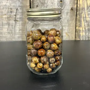A Collection of Vintage Glass Marbles in a Clear Glass Mason Jar