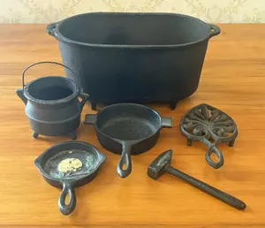 A Collection of Miniature Cast Iron Cookware and Kitchen Items