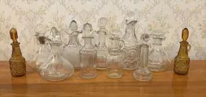 Eleven Vintage Amber and Clear Glass Cruets and Decanters Including Novelty Telephone Bottle