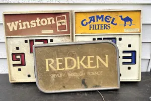 A Trio of Vintage Advertising Displays Including Camel and Winston Clocks and a Redken Lighted Sign