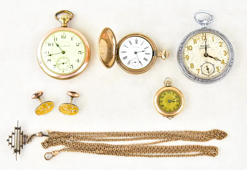 THREE GOLD-PLATED POCKET WATCHES & ACCESSORIES: HAMPDEN, WALTHAM, A. RACINE from auction in Aurora, Oregon — image 39
