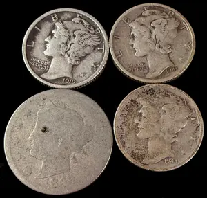 A Collection of Four US Coins Including Mercury Silver Dimes and an 1894 Liberty Head Nickel