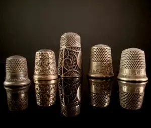 A Collection of Five Sterling Silver Thimbles Including Victorian Repousse and Filigree Examples
