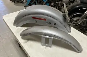A Pair of Silver Metallic Pinstriped Motorcycle Fenders