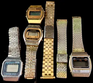 A Collection of Vintage Digital LCD Quartz Wristwatches and Metal Bands