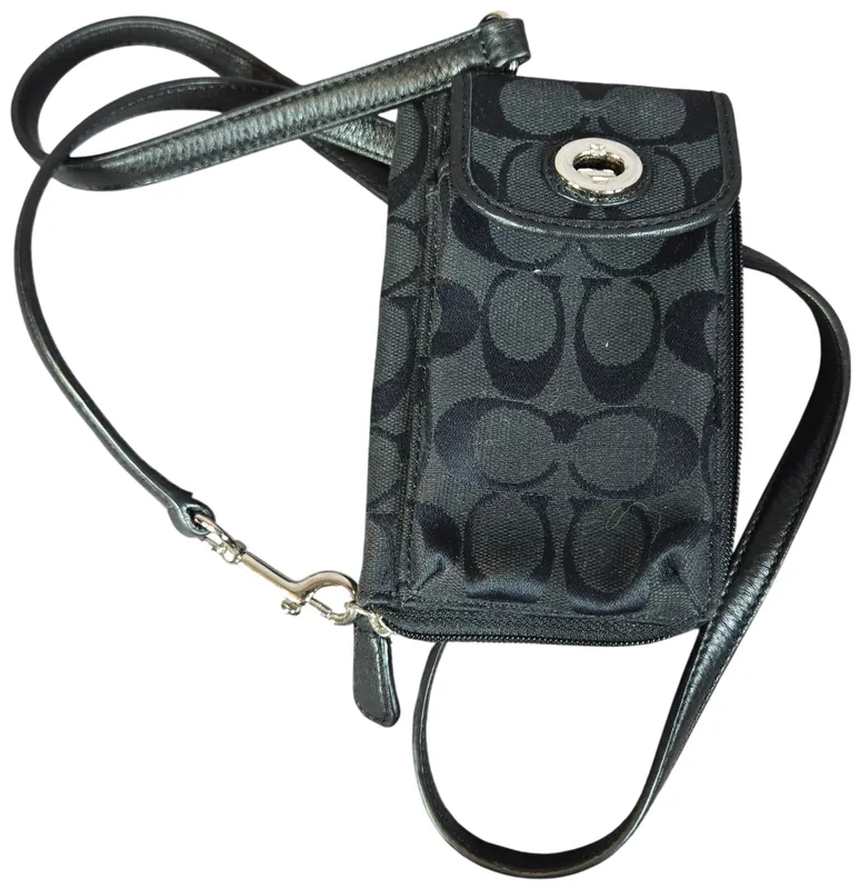 Coach Signature Jacquard and Leather Crossbody Phone Wallet from auction in Lancaster, Ohio — image 46