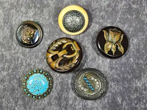 An Assortment of Vintage and Antique Ornamental Buttons Including Egyptian Revival and Art Deco Styles